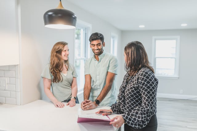 a-couple-discussing-their-homes-value-with-an-expert.png