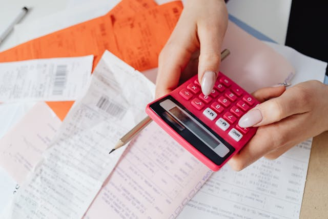 a-person-using-a-pink-calculator.png