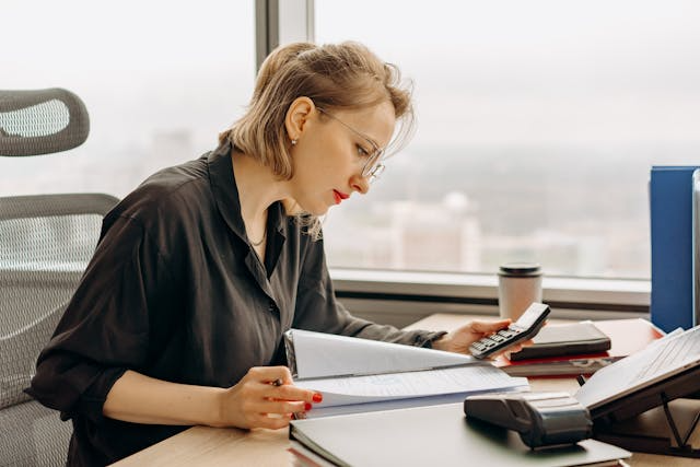 an-accountant-using-a-calculator.png