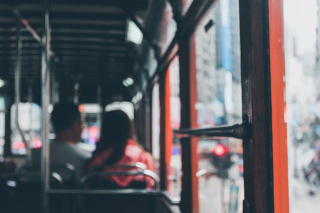 POV-of-someone-sitting-at-the-back-of-a-city-bus.png
