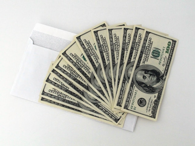 a-bunch-of-one-hundred-dollar-bills.png